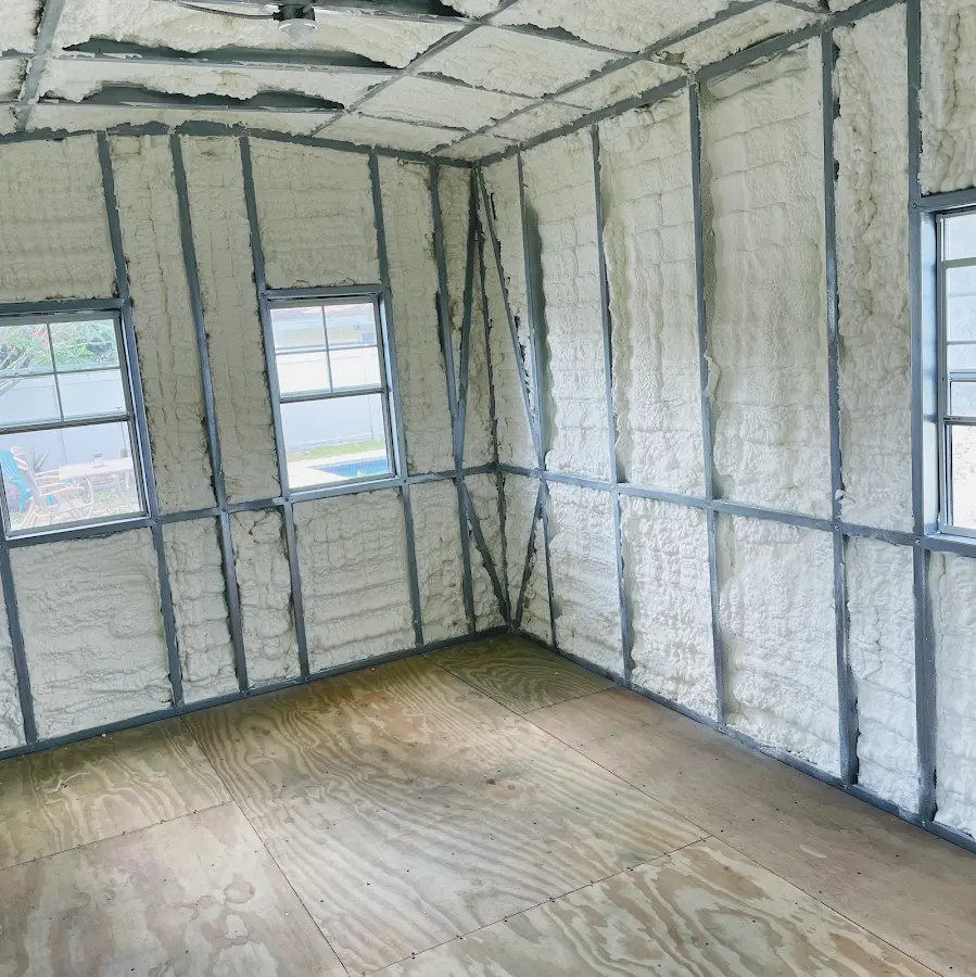 Closed-cell spray foam insulation applied to wall cavities in a residential project in De Witt